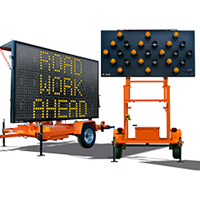 large light up signs for construction on roadway - road work ahead and arrows indicating a lane shift
